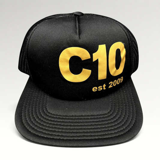 Raree Finds black Otto trucker snapback hat with gold C10 graphic and mesh back panels.