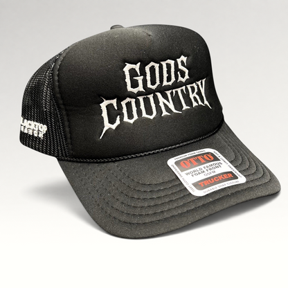 Raree Finds black foam trucker hat with white gothic God's Country embroidery, mesh back, and adjustable snapback.