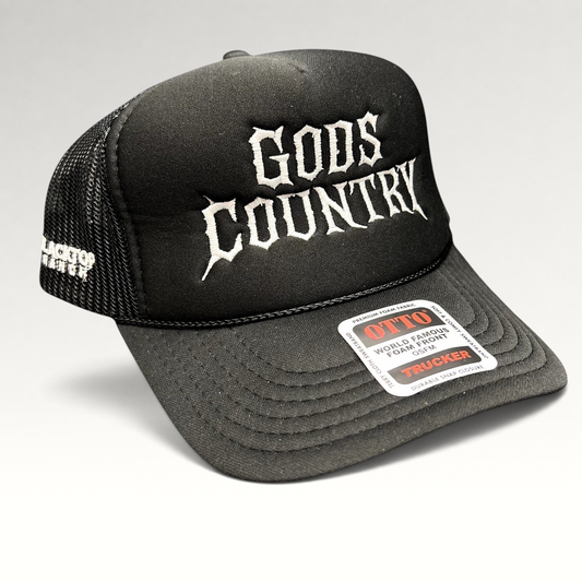 Raree Finds black foam trucker hat with white gothic God's Country embroidery, mesh back, and adjustable snapback.