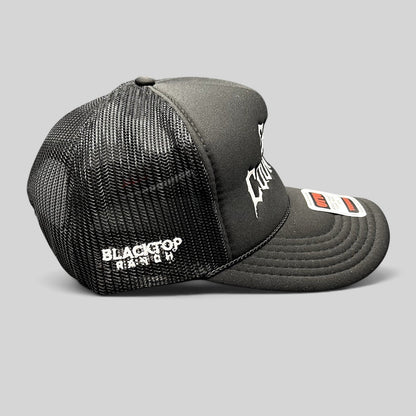 Raree Finds black trucker hat with white gothic embroidery, mesh back, and rope detail on a foam-front OTTO cap.