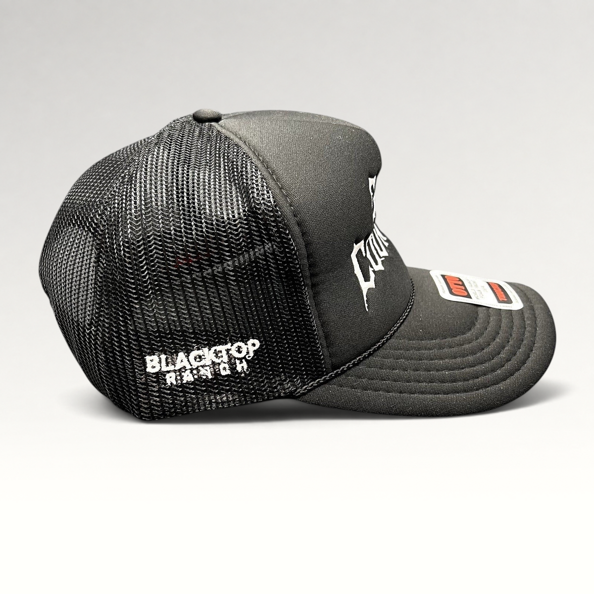 Raree Finds black trucker hat with white gothic embroidery, mesh back, and rope detail on a foam-front OTTO cap.