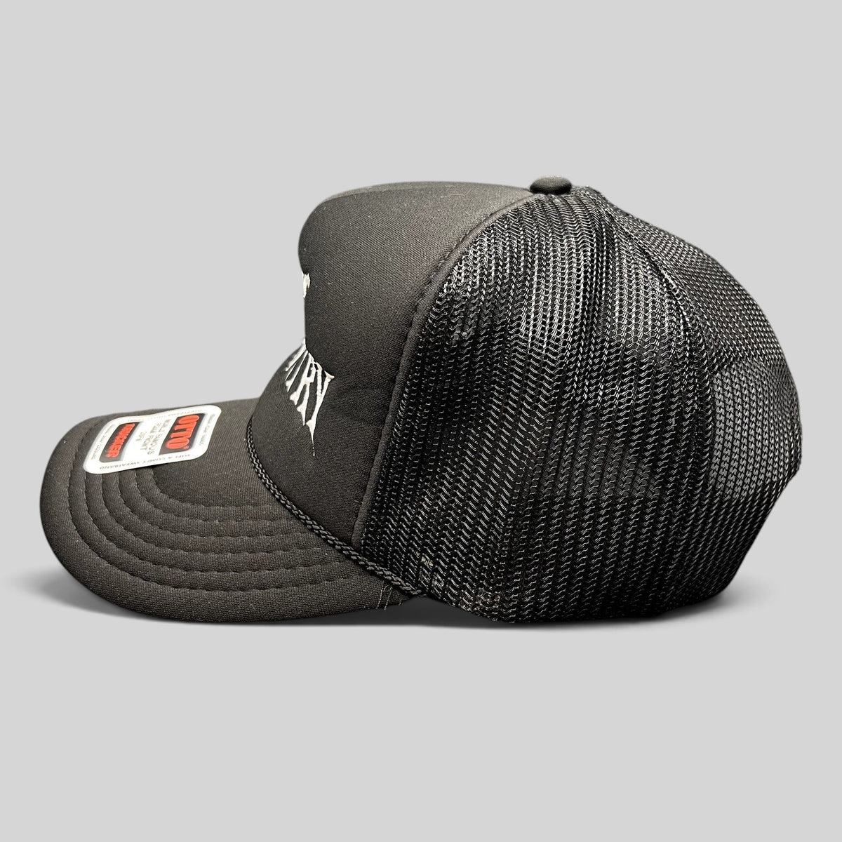Raree Finds black foam trucker hat with white gothic God's Country embroidery, mesh back, and rope detail.