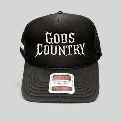 Raree Finds black trucker hat with white gothic God's Country embroidery, foam front, and mesh back.