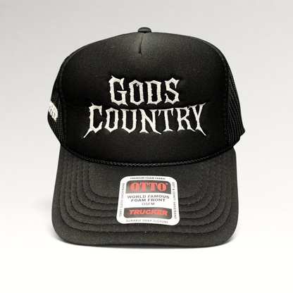 Raree Finds black trucker hat with white gothic God's Country embroidery, foam front, and mesh back.