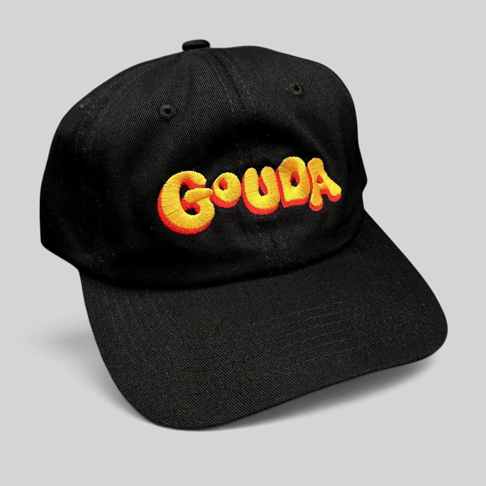 Raree Finds black cotton strapback hat with colorful embroidered Gouda logo and curved brim