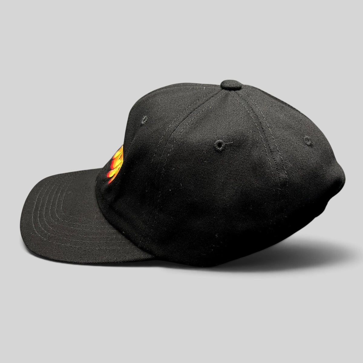 Raree Finds black cotton strapback hat with colorful embroidered Gouda cheese graphic and curved brim