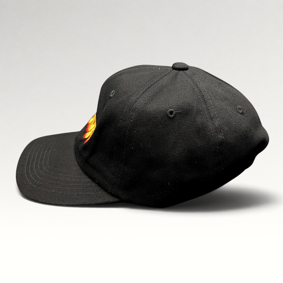 Raree Finds black cotton strapback hat with colorful embroidered Gouda cheese graphic and curved brim