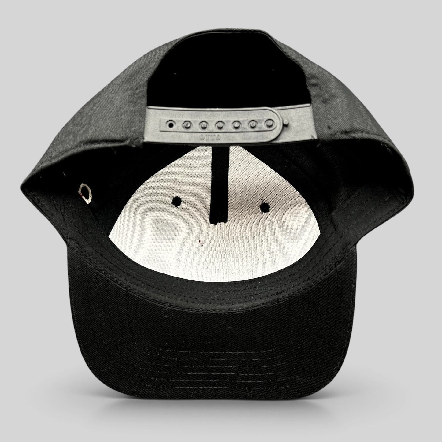 Raree Finds black Grammy U snapback hat showing the interior adjustable plastic snap closure and structured crown