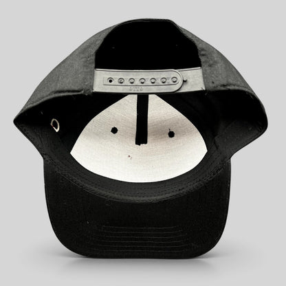Raree Finds black Grammy U snapback hat showing the interior adjustable plastic snap closure and structured crown