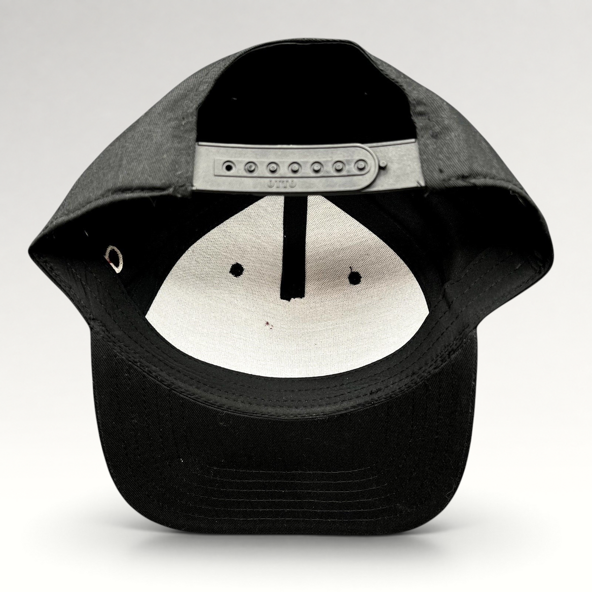 Raree Finds black Grammy U snapback hat showing the interior adjustable plastic snap closure and structured crown