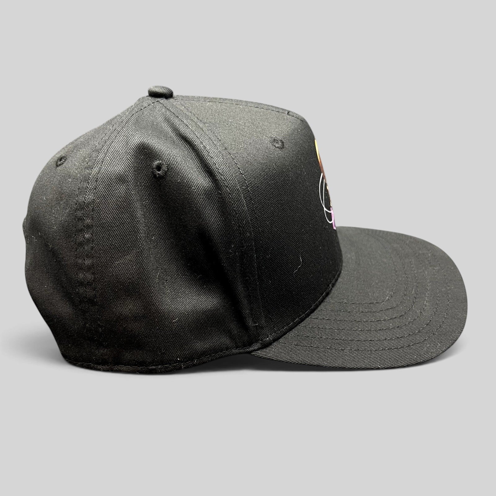Raree Finds black Grammy U snapback hat with a structured crown and flat bill, side view.