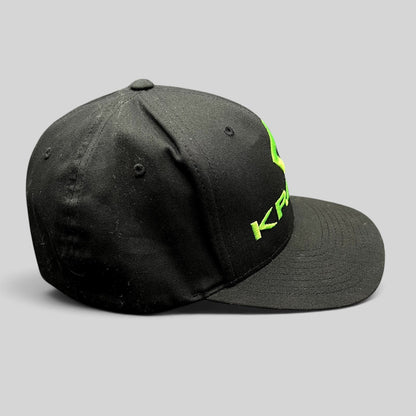 Raree Finds black Krank Golf Flexfit cap with bright green embroidered logo on the side, size L/XL.