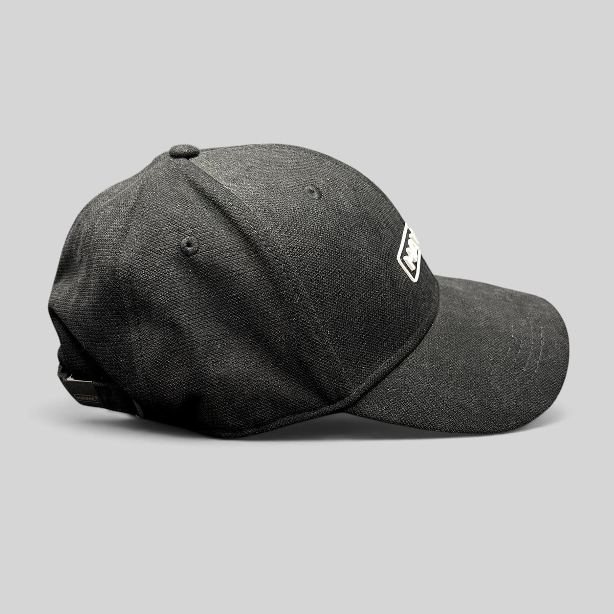 Raree Finds black HAWK strapback cap in lightweight polyamide with an embroidered boxed logo and adjustable buckle.