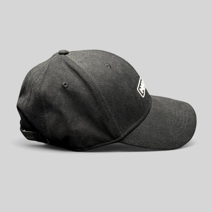 Raree Finds black HAWK strapback cap in lightweight polyamide with an embroidered boxed logo and adjustable buckle.