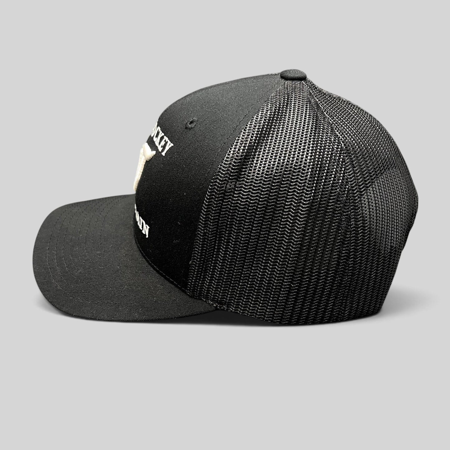 Raree Finds black Yupoong Classics trucker hat with white embroidered Make Hockey Violent Again slogan and mesh back