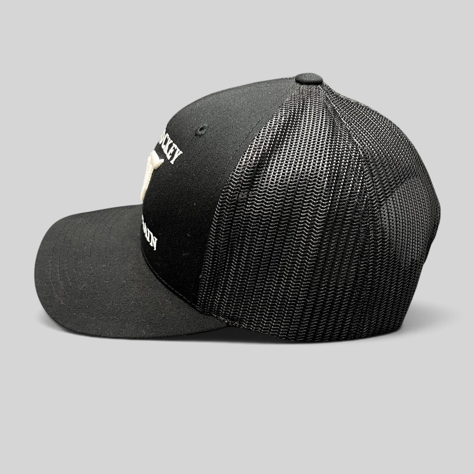 Raree Finds black Yupoong Classics trucker hat with white embroidered Make Hockey Violent Again slogan and mesh back