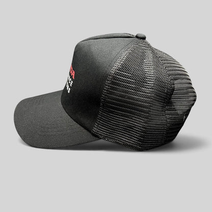 Raree Finds black Honda Insurance Solutions trucker hat with mesh back, red and white logo, and adjustable snapback.