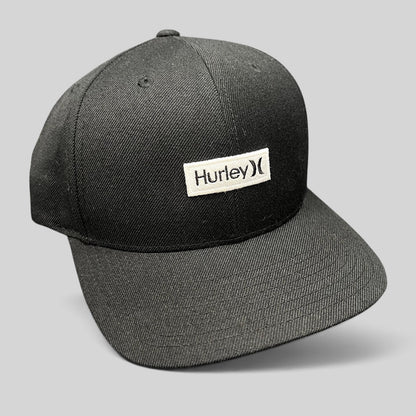 Raree Finds black Hurley snapback hat with a woven logo patch on a structured Yupoong The Classics crown.