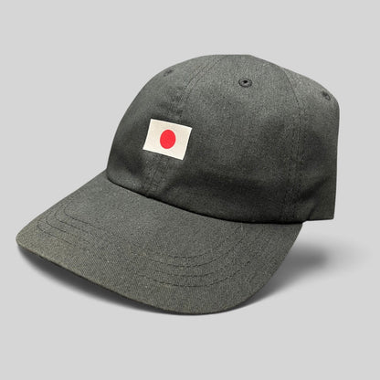 Raree Finds black cotton strapback dad hat featuring a centered Japanese flag graphic on the front.