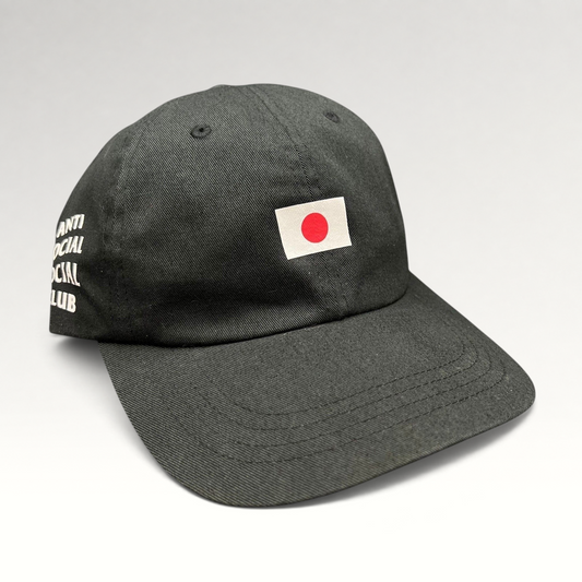 Raree Finds black Anti Social Social Club strapback hat with a Japanese flag graphic on the front