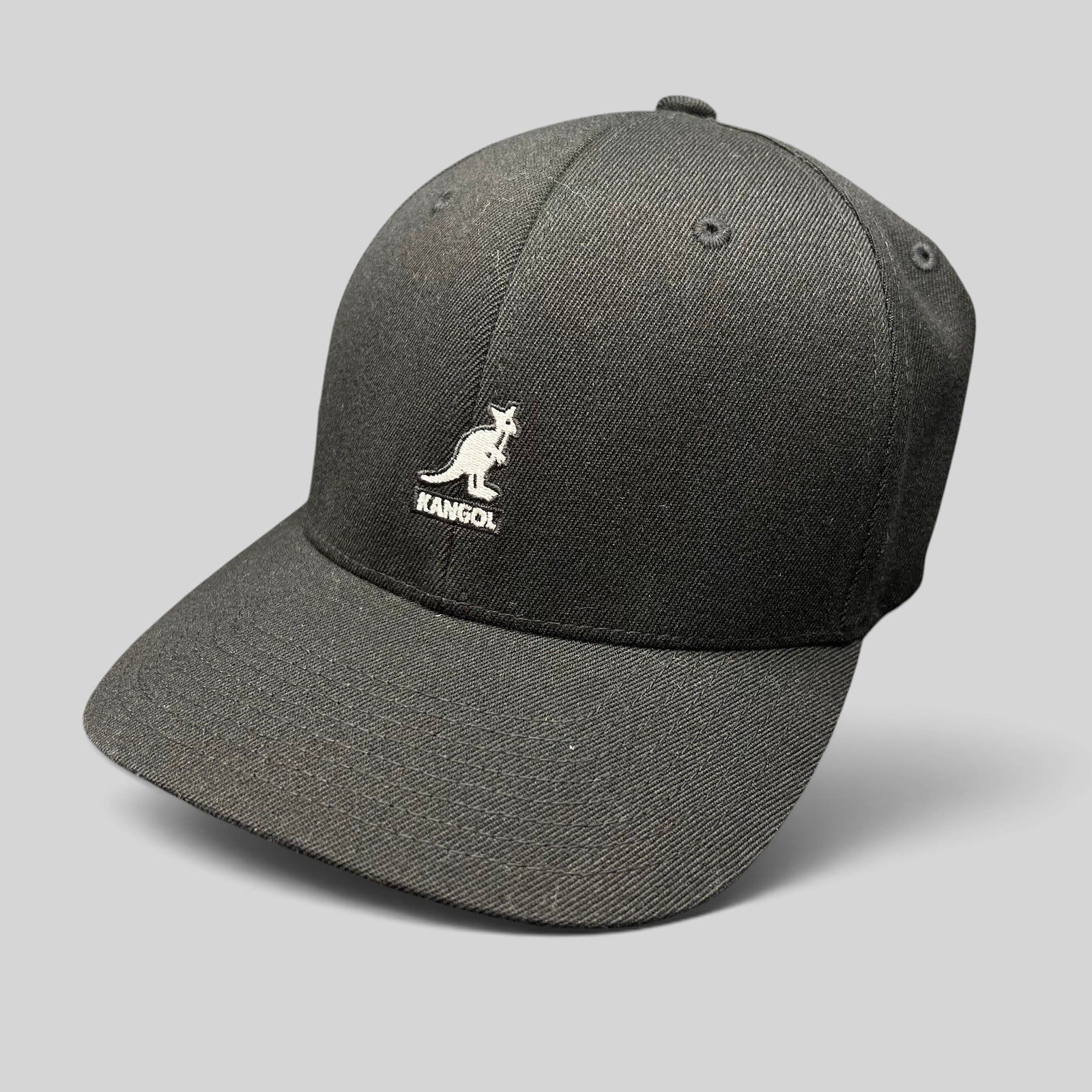 Raree Finds black Kangol flexfit baseball cap with white embroidered kangaroo logo on a structured crown