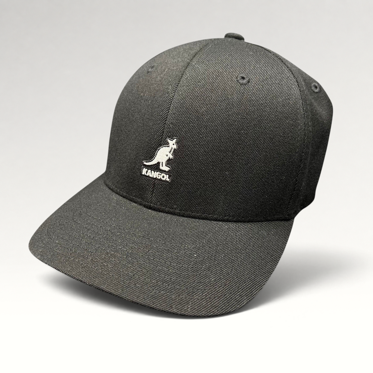 Raree Finds black Kangol flexfit baseball cap with white embroidered kangaroo logo on a structured crown