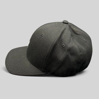 Raree Finds black Kangol flexfit baseball cap with a structured crown and curved brim shown from the side profile.