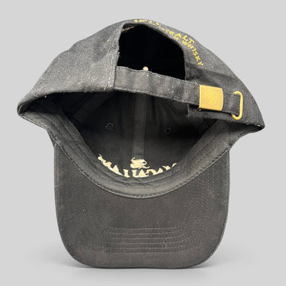 Raree Finds black Macallan Scotch Whisky strapback hat with gold metal buckle closure and embroidered logo detail