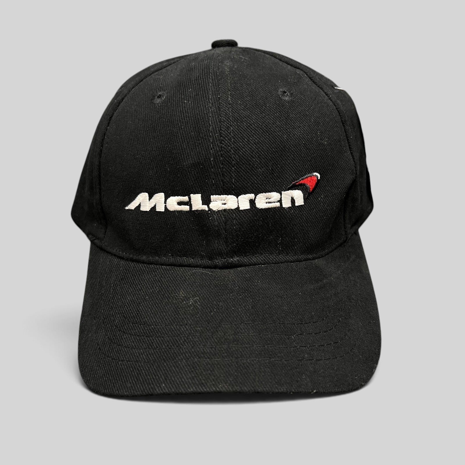 Raree Finds black cotton McLaren strapback hat with embroidered white wordmark and red speedmark logo