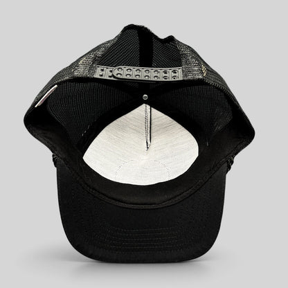 Raree Finds vintage black mesh trucker hat showing the interior foam lining and adjustable snapback closure
