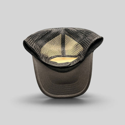 Raree Finds black trucker hat with breathable mesh back and adjustable snapback closure viewed from the rear