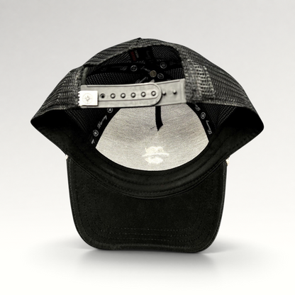 Raree Finds black trucker hat from the Discovery Collection with a breathable mesh back and adjustable snapback closure