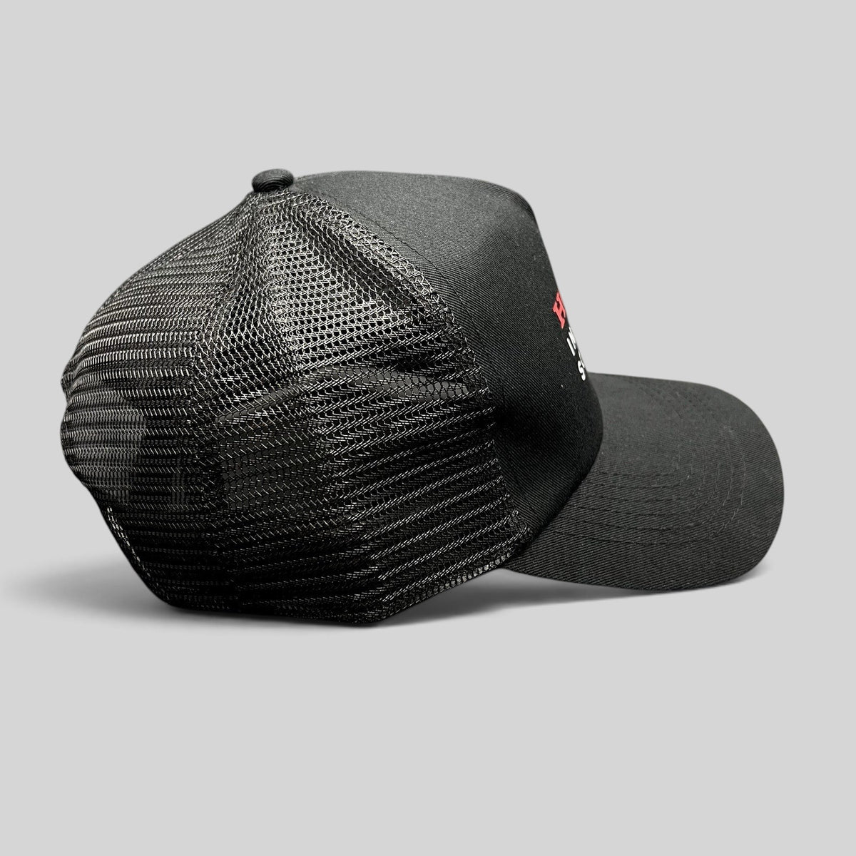 Raree Finds black mesh trucker hat with structured front panel and red and white Honda Insurance Solutions logo
