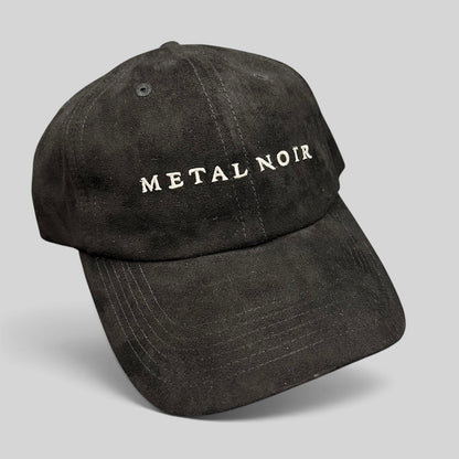 Raree Finds black unstructured strapback hat with white Metal Noir embroidery and a soft suede-like finish