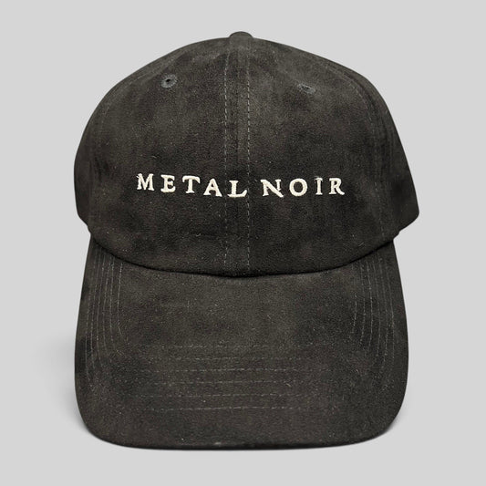 Raree Finds black unstructured strapback hat with white Metal Noir embroidery and a soft suede-like finish