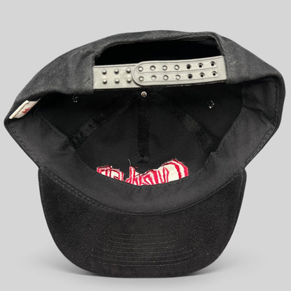 Raree Finds black cotton snapback hat with red Curdled metal band logo embroidery, showing adjustable back strap.