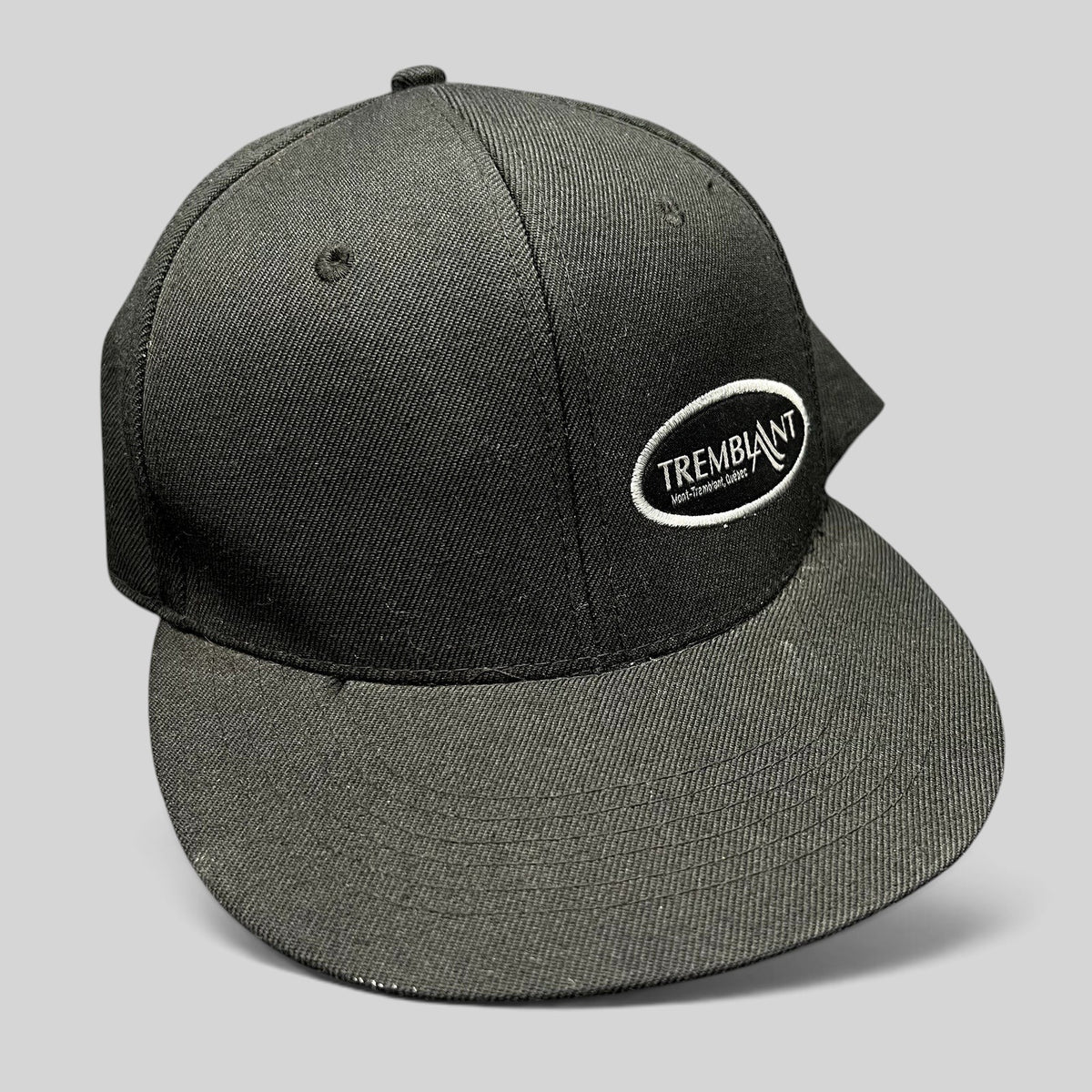Raree Finds black Fits snapback hat featuring an embroidered white oval Mont Tremblant ski resort logo on the front.