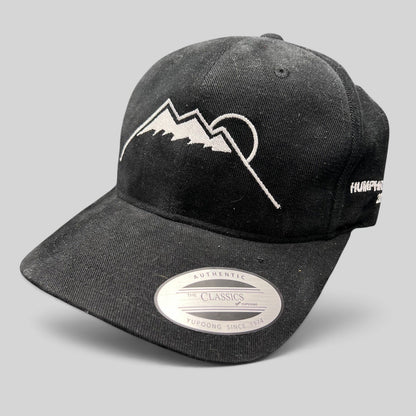 Raree Finds black Yupoong strapback hat featuring a white embroidered Humphreys Peak mountain and sun graphic