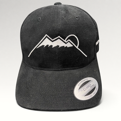 Raree Finds black Yupoong strapback hat featuring a white embroidered Humphreys Peak mountain and sun graphic