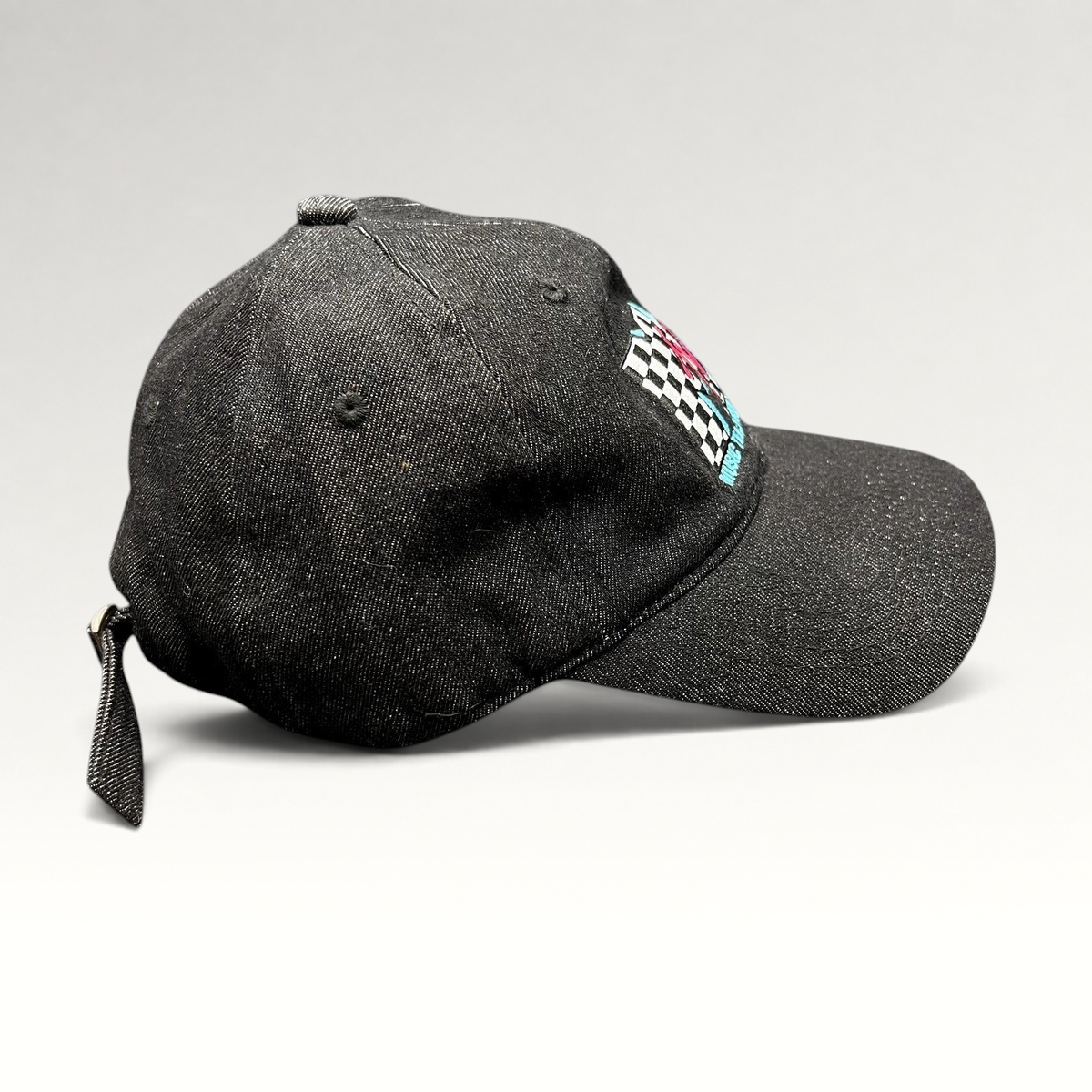 Raree Finds black MTV Music Television strapback hat with checkered logo embroidery and curved brim side view