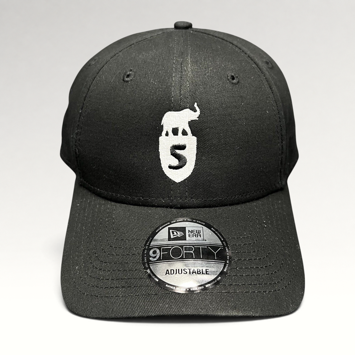 Raree Finds black New Era 9FORTY strapback hat with white embroidered elephant and shield crest logo on front