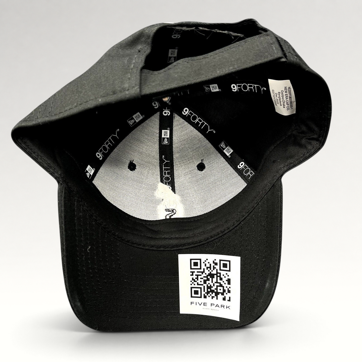 Raree Finds black New Era 9FORTY strapback hat interior view showing branding and Five Park Miami Beach QR code tag
