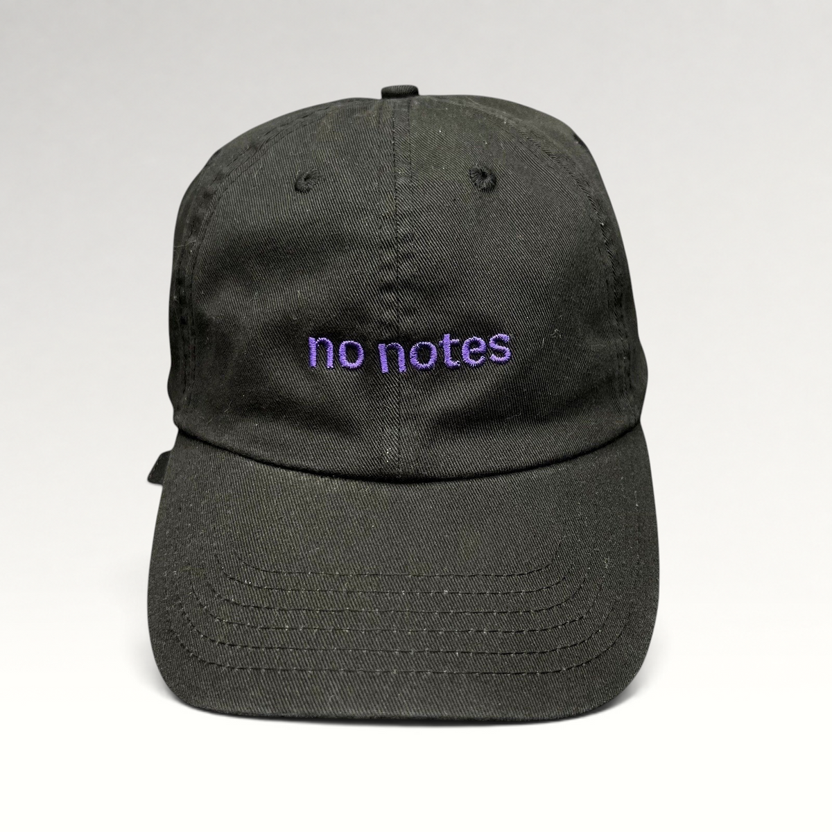 Raree Finds black cotton twill dad hat with purple embroidered no notes text on the front