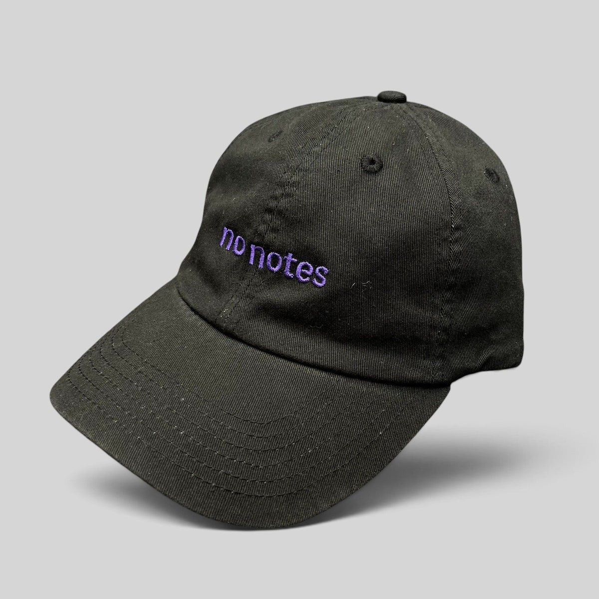 Raree Finds black cotton twill dad hat with purple embroidered No Notes text on the front