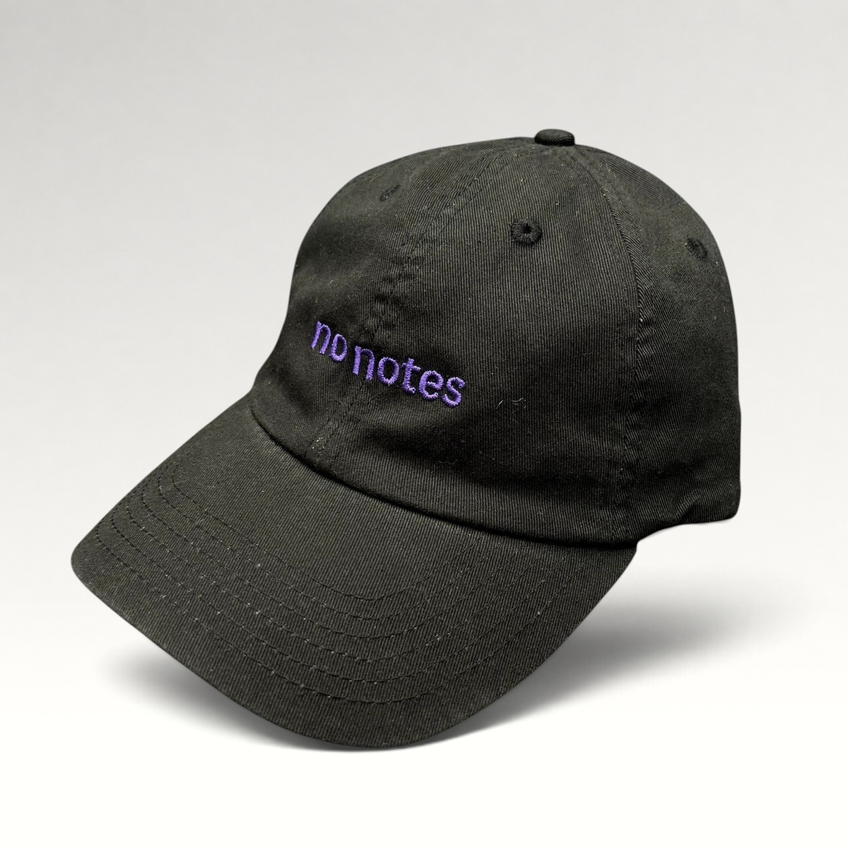 Raree Finds black cotton twill dad hat with purple embroidered no notes text on the front