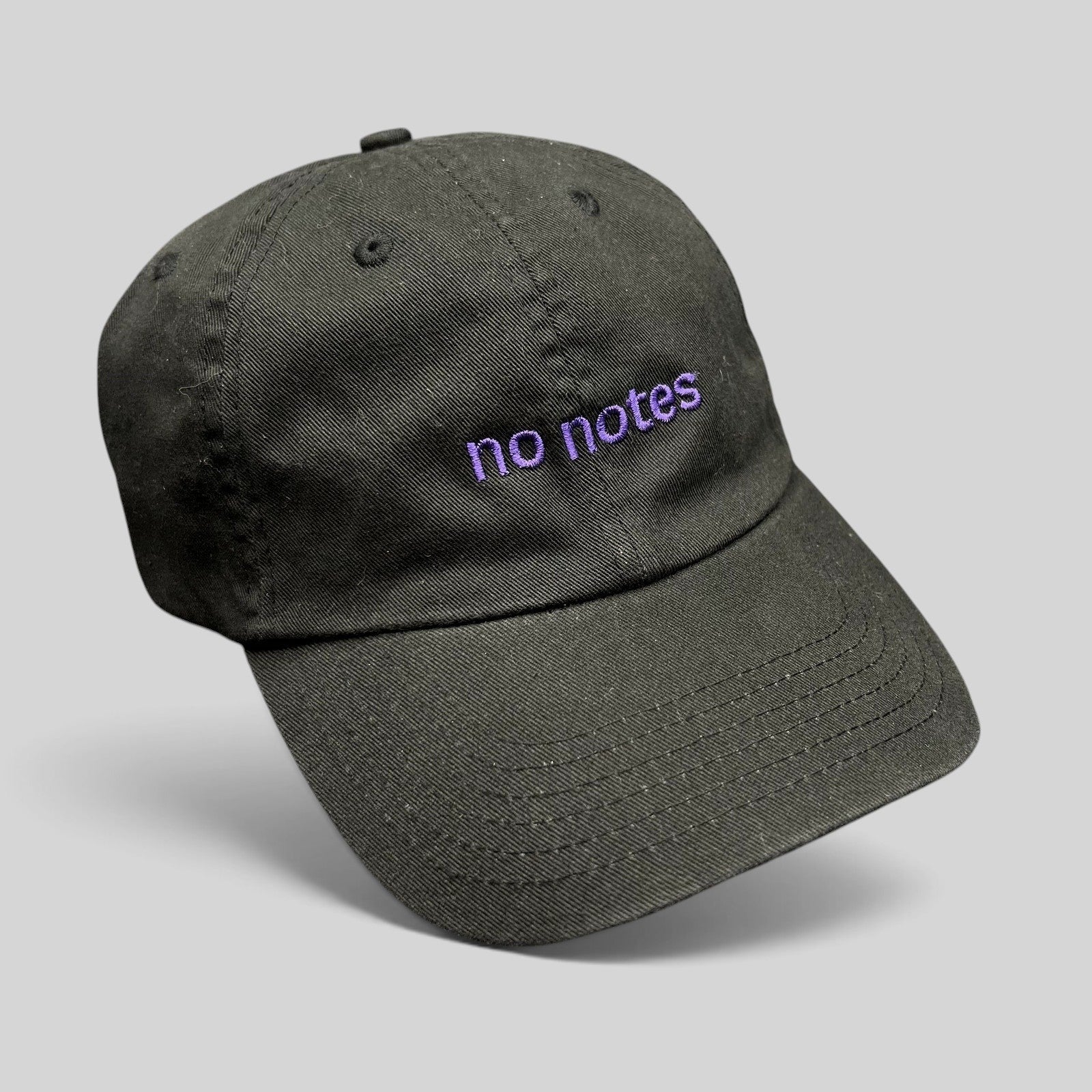 Raree Finds black cotton twill dad hat with purple embroidered no notes text on the front