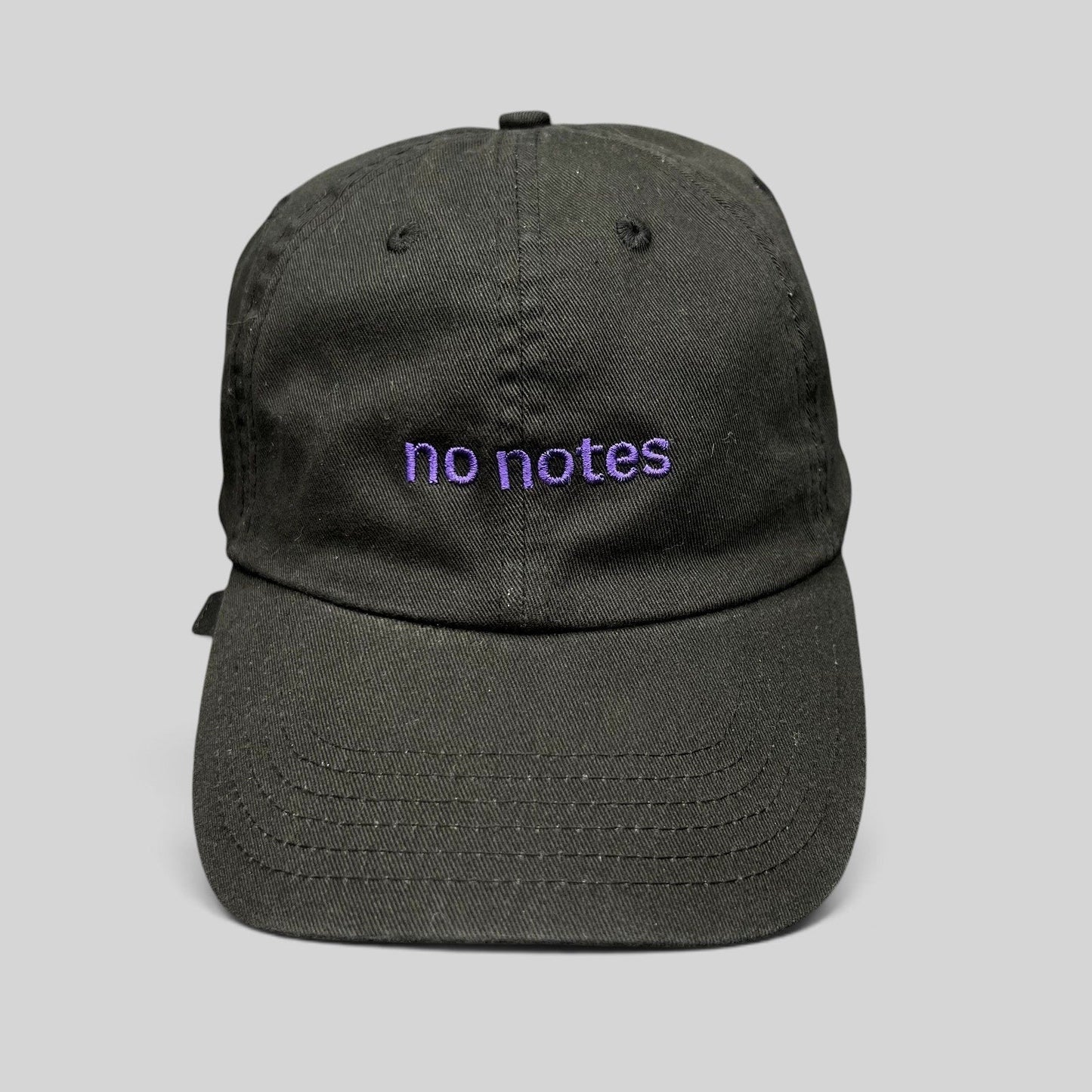 Raree Finds black cotton twill dad hat with purple embroidered no notes text on the front