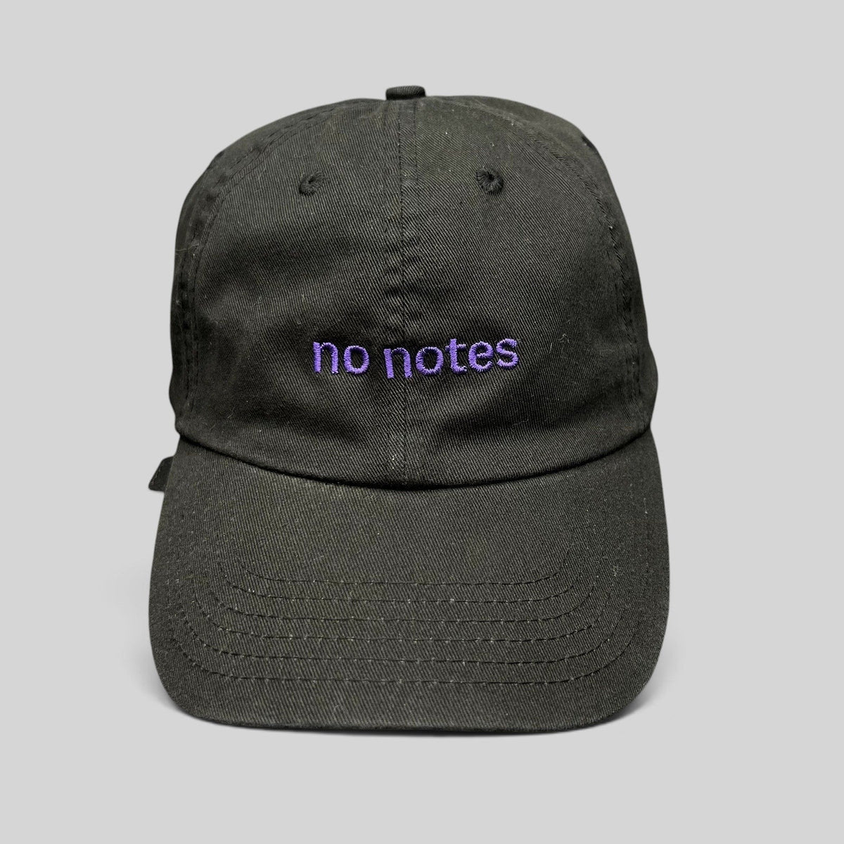 Raree Finds black cotton twill dad hat with purple embroidered no notes text on the front