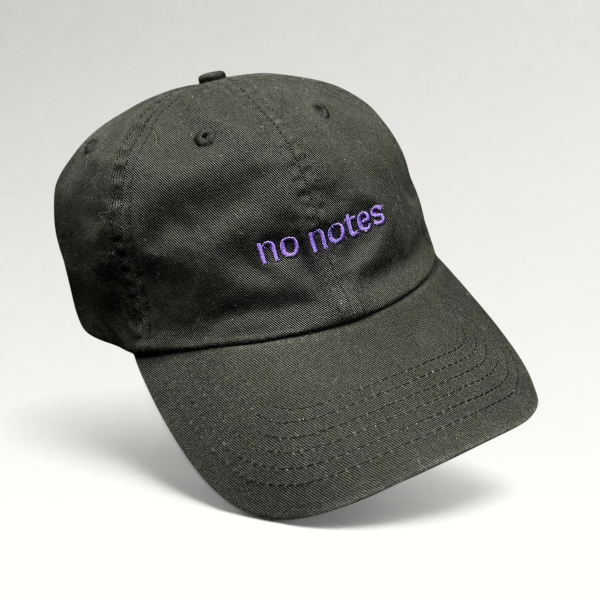 Raree Finds black cotton twill dad hat with purple embroidered no notes text on the front