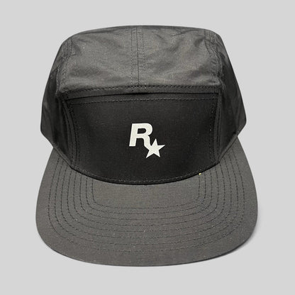 Raree Finds black nylon 5-panel camp hat by Yupoong featuring a white Rockstar Games logo on the front